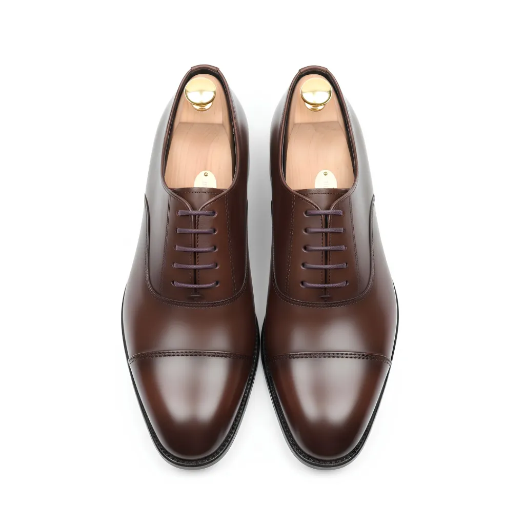 Original Leather Oxford Shoes in Dark Brown add a smart touch to any wardrobe. Pair them with tailored trousers for office wear or formal events.